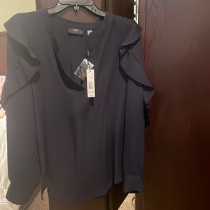 New. Never been worn Tahari navy blue blouse.